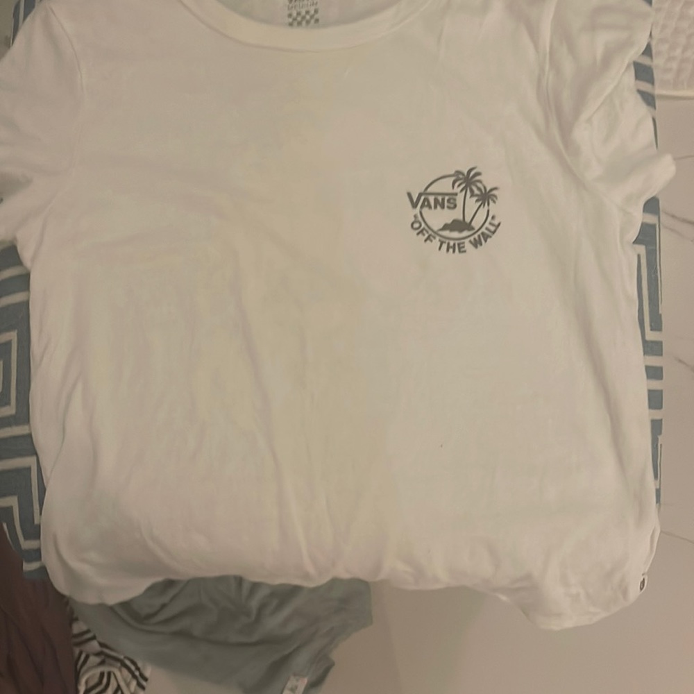 A vans white crop top , a medium